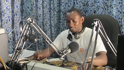 A DJ at his mixing desk 