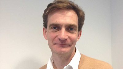 Cassian Harrison in open-collared shirt and jacket.