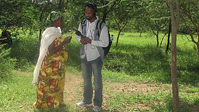 A man interviewing a pregnant woman