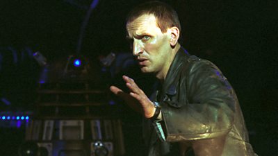Christopher Eccleston as Doctor Who looking frightened as the Daleks rumble towards him. 