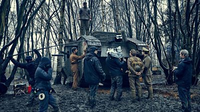 Cast and crew with the tank on location.