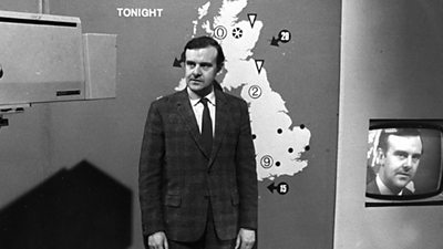 Bert Foord in front of tonight's weather, with his face duplicated in a monitor to his right. 