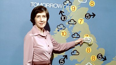 Barbara Edwards pins a magnetic symbol for overcast over the Midlands. 