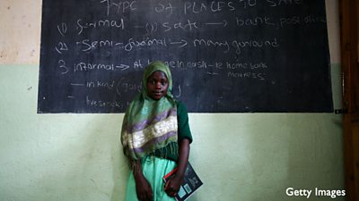 A girl attends class in Kibera, Kenya