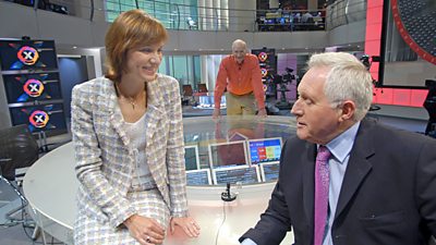 Fiona Bruce and David Dimbleby share a joke in the more airy 2005 election studio. Peter Snow leans on the desk behind.  