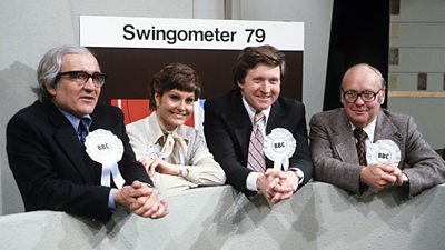 The four presenters for 1979 look relaxed posing for a promotional picture. They each wear white rosettes with ý in the centre. 