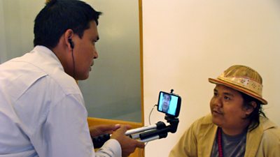 One of the MOELJO trainers interviewing an extra - playing the role of a farmer