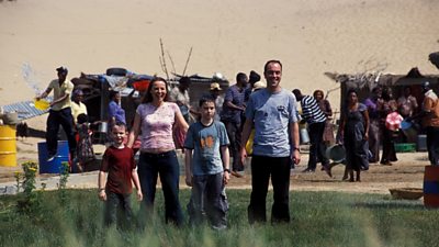 The cast of Millions look hot and sweaty but cheerful in Africa