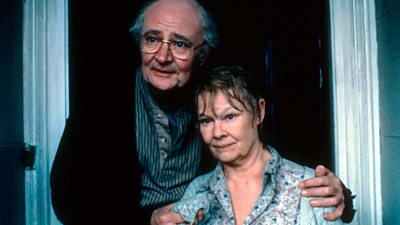 Jim Broadbent as John Bayley puts it arm affectionately around Judi Dench as an ill Iris Murdoch. 