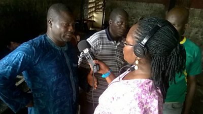 A Harvest FM producer interviewing a meat seller