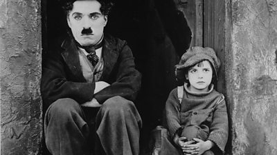 Charlie Chaplin and Jackie Coogan in a publicity shot for The Kid.
