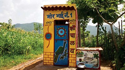 A decorated outdoor toilet