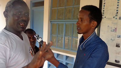 Siyad (right) interviews Mohamed Abei, a community leader in Wajir County