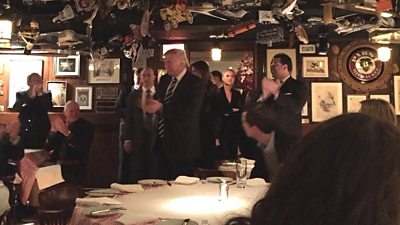 Donald Trump greets diners