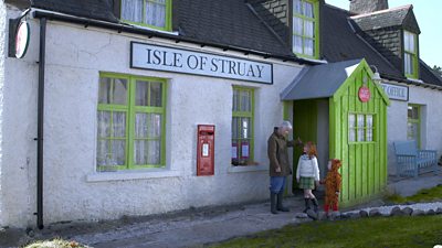 Katie Morag (Cherry Campbell) Liam (Peter and Finlay MacMillan) and Grannie Island (Ann Louise Ross) outside the Post Office