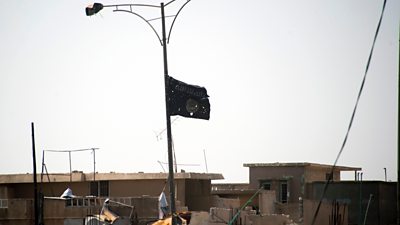 Islamic State flag flies in tatters in Mosul