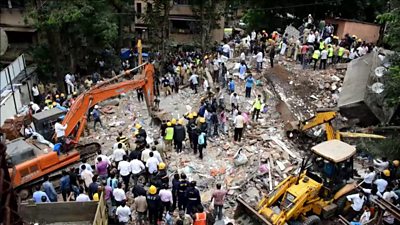 India building collapse: Rescuers search for survivors - BBC News