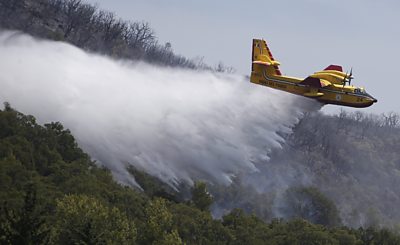 Water-bombing plane dousing fire near Bormes