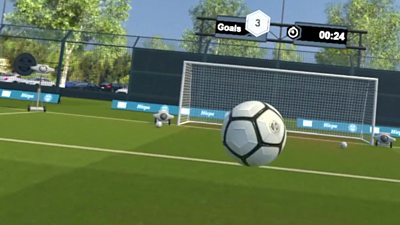 A football being kicked towards the goal in virtual reality