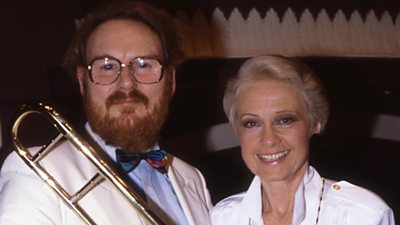 Barry Forgie and Sheila Tracy pose with a trombone