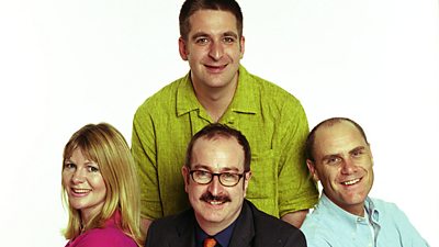 A promotional photo of Janey Lee Grace, Steve Wright, Miles Mendoza (standing) and Tim Smith in a white studio