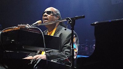 Stevie Wonder sings and plays the piano