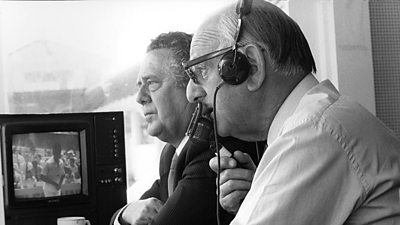 Trevor Bailey and Brian Johnston keeping an eye on proceedings on the cricket field from the commentary box