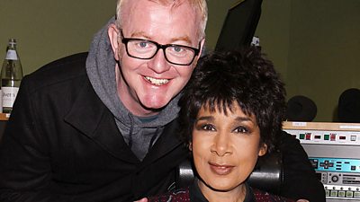 Chris Evans with his arm around newsreader Moira Stuart in the studio