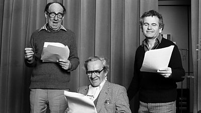 Michael Hordern, John Le Mesurier and Ian Holm looking relaxed in the drama studio reading scripts. Hordern is gesticulating. 