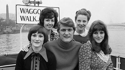 Pete Murray poses with four women on a boat