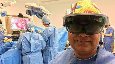 Shafi Ahmed, a surgeon, wears a HoloLens in an operating theatre