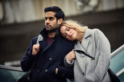 Sathnam (SACHA DHAWAN), Laura (JOANNA VANDERHAM Image Credit: BBC/Parti Productions/Kudos Photographer: Robert Viglasky