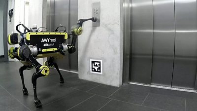 A robot summoning a lift