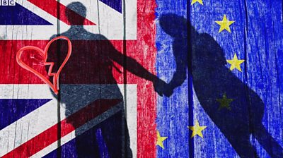 Couple in shadow with EU and UK flag behind them