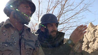 Auliya Atrafi with an Afghan soldier