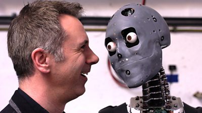 Spencer Kelly (L) and a humanoid robot (R)