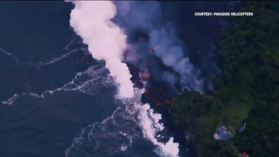 Lava flow meets the sea on Kilauea sending up plumes of toxic vog.