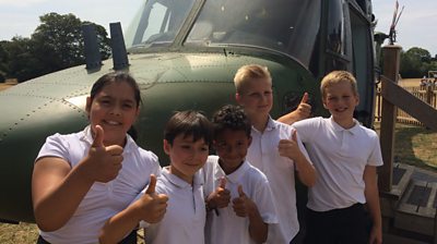 Pupils with the helicopter at their school
