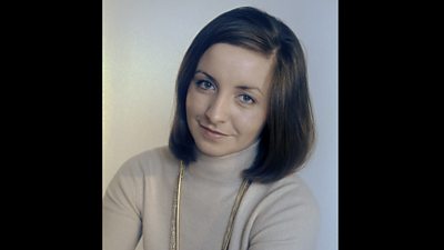 Sue Lawley smiles at the camera in 1974. She is wearing a roll-top sweater.