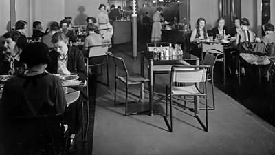 A 1930s canteen. All of the people in the canteen are women. 