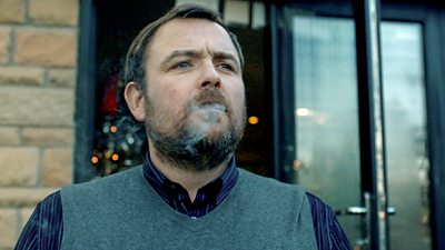 Neil Maskell as Colin Burstead smokes on his veranda 