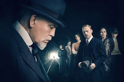 The ABC Murders (Hercule Poirot (JOHN MALKOVICH), Mrs Rose Marbury (SHIRLEY HENDERSON), Franklin Clarke (ANDREW BUCHAN), Thora (FREYA MAVOR), Inspector Crome (RUPERT GRINT), Lady Hermione Clarke (TARA FITZGERALD), Cust (EAMON FARREN) Image Credit: BBC/Mammoth Screen/Agatha Christie Ltd Photographer: Charlie Gray and Ben Blackall