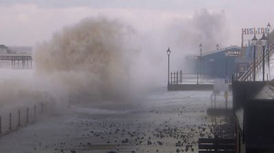 Waves crashing on sea wall at Cromer