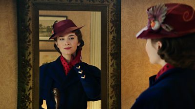 Mary Poppins looking in a mirror
