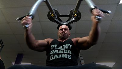 Paul Kerton working out in a gym