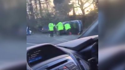 Video still of duke's overturned car