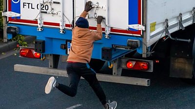Migrant trying to open back of lorry
