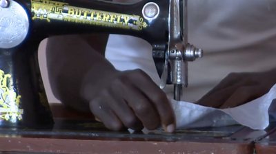 A former Boko Haram fighter sewing