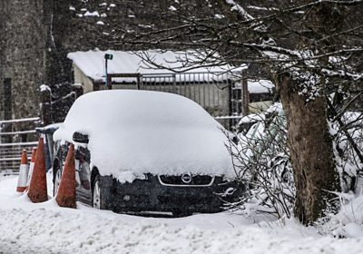 Car covered in snow near  near Newby Head in North Yorkshire