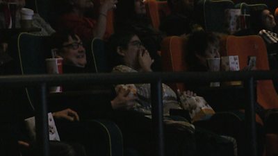People watching a screening